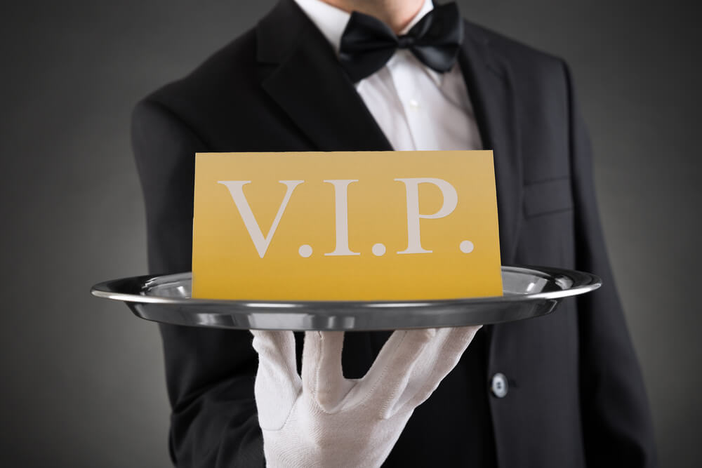 Close up,Of,Waiter,Showing,Vip,Text,On,Banner